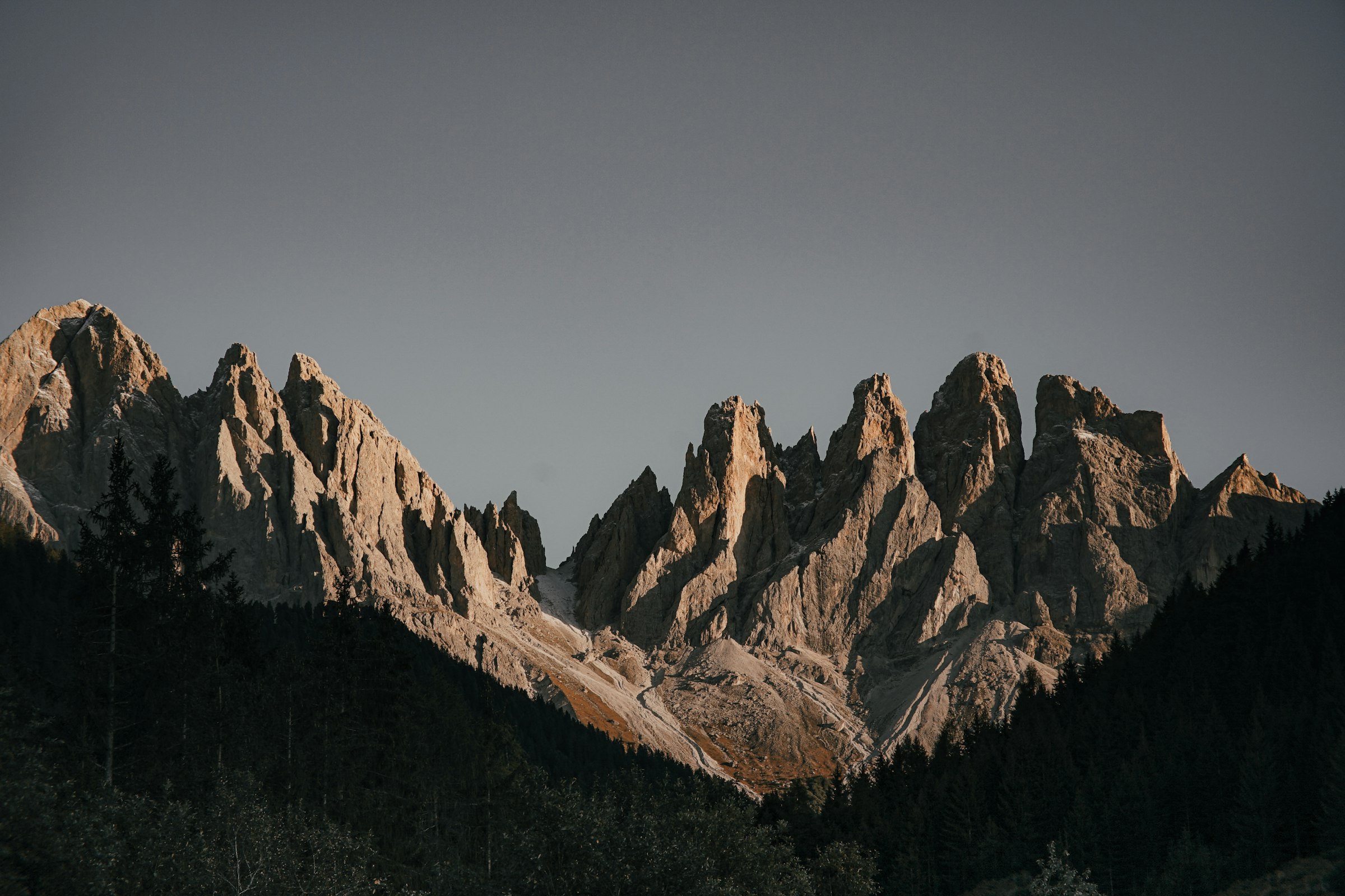 Jagged rocky peaks under a grey sky