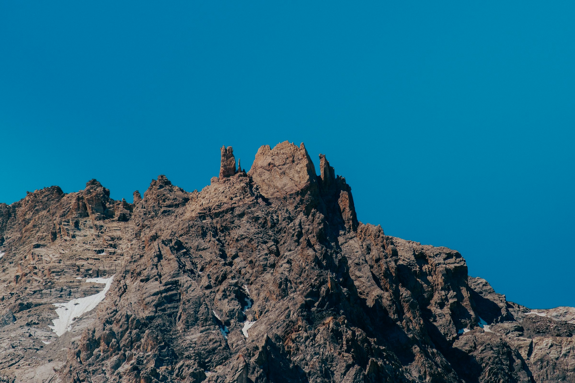 Jagged rocky peak against a clear sky